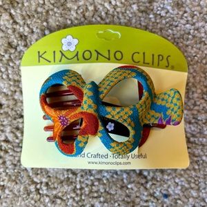 Butterfly hair clip covered in upcycled kimono fabric. Claw clip